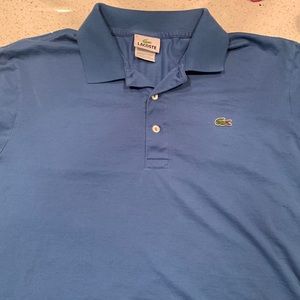 Lacoste polo. Blue in color. Size: 5 or L.